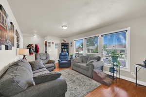 Another view of living area and beautiful windows letting in lots of light.