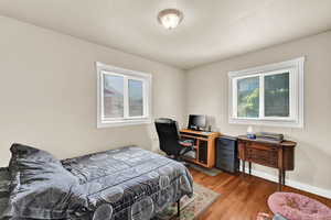 Bedroom with light wood floors.