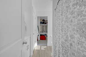 Hallway featuring light wood-type flooring