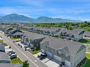 Aerial view of residential area featuring a mountainous background