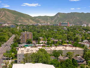 View of mountain backdrop featuring nearby urban area