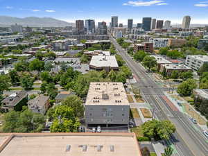 View of urban area with a mountainous background and a major roadway
