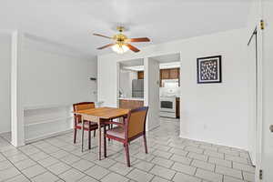 Dining space featuring a ceiling fan