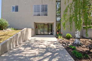 Entrance to property featuring stucco siding