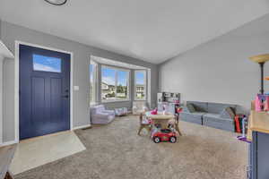 Recreation room featuring carpet and baseboards