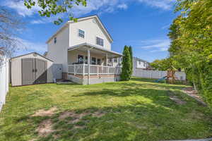 Rear view of property featuring a playground