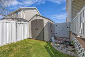 View of shed featuring a gate