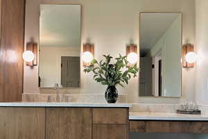 Bathroom with vanity and a textured ceiling