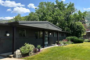View of front facade featuring a front lawn and brick siding