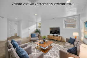Living room featuring recessed lighting and baseboards