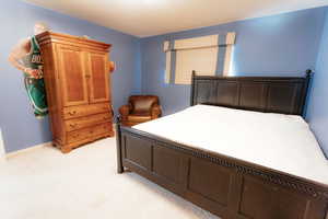 Bedroom with light colored carpet