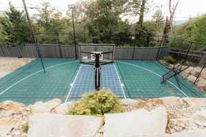View of sport court with a tennis court and basketball court