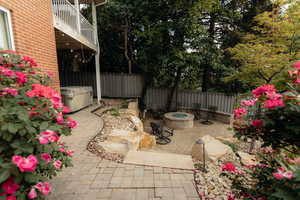 View of patio / terrace featuring a fire pit and a balcony