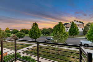 View of yard featuring a balcony