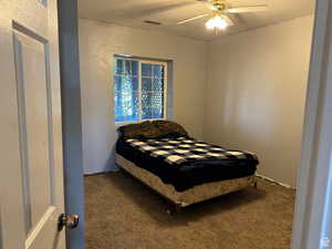 Bedroom featuring carpet and ceiling fan