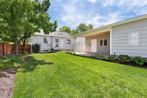 Rear view of house with a patio