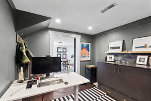 Office area featuring recessed lighting
