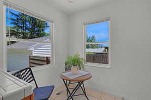 Sitting room featuring baseboards and light tile patterned floors