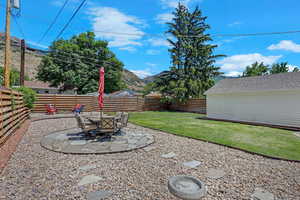 View of yard with a patio and a mountain view