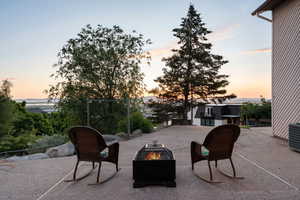 View of patio with an outdoor fire pit