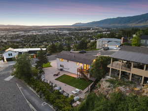 Aerial view of property and surrounding area featuring a mountain backdrop and valley views