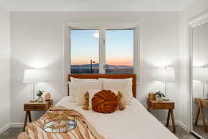 Primary bedroom with sunset views