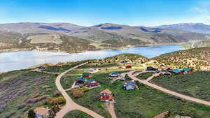 View of property location with a water and mountain view
