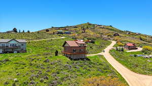 Aerial view of property and surrounding area with mountains