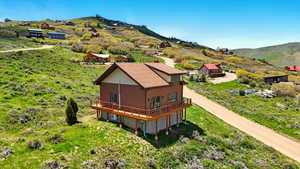 View from above of property featuring a mountainous background