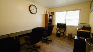Office with wood finished floors