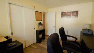 Office space featuring wood finished floors