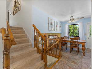 Dining space featuring stairway and ceiling fan