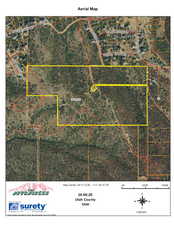 Aerial map of property and surrounding area featuring property boundaries highlighted