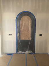 Partially installed iron front door.