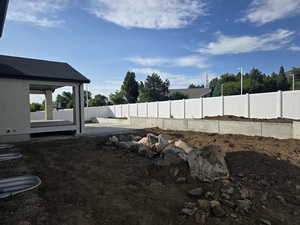 Retaining wall across the rear of the lot.
