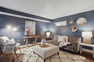 Living room with baseboards and wood finished floors
