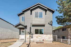 View of front of house featuring stone siding