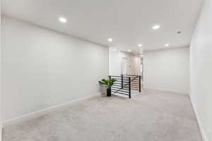 Empty room with recessed lighting, carpet flooring, and baseboards