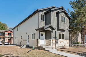 View of front of house featuring stone siding