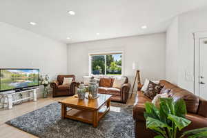 Living area featuring recessed lighting and wood finished floors