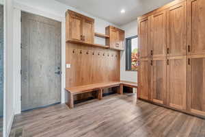 Mudroom featuring wood finished floors and recessed lighting