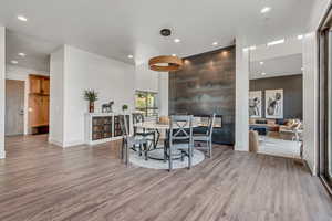 Dining area featuring wood finished floors, recessed lighting, and baseboards