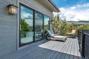 Wooden terrace featuring a mountain view