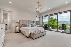Bedroom with access to outside, light colored carpet, a chandelier, recessed lighting, and baseboards