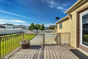 Deck featuring a patio area and a residential view