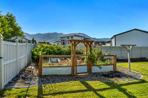 View of yard with a mountain view and a garden