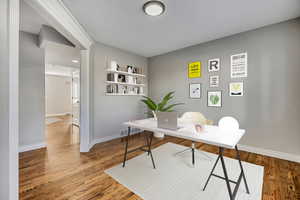 Office with baseboards and wood finished floors