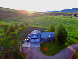 Aerial view of sparsely populated area with a mountain backdrop