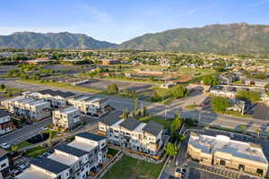 Aerial perspective of suburban area with a mountain backdrop