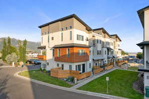 View of property featuring a mountain view and a residential view